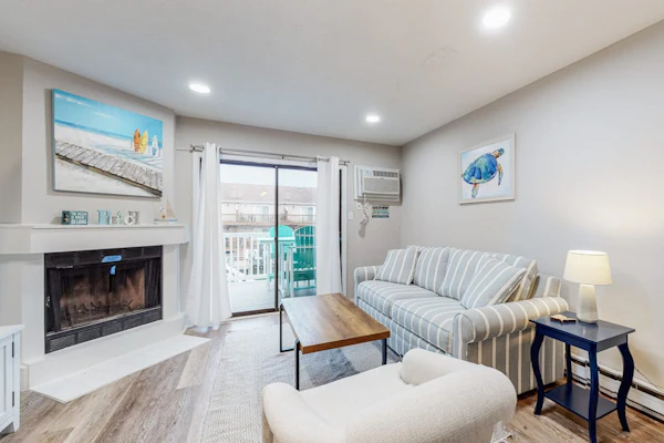Canal-front townhome with front/back decks, shared pool, private w/d, & WiFi
