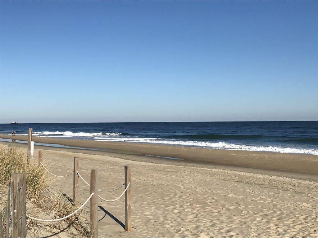 Newly-renovated condo - one block from the beach with private W/D & shared pool