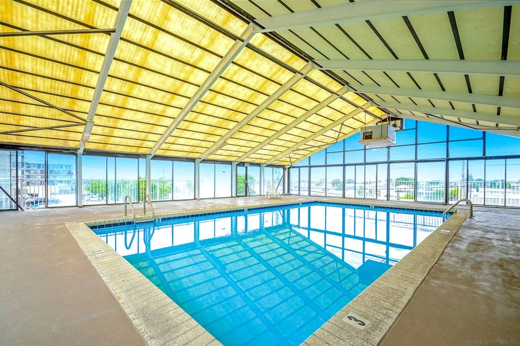 Condo One Block from the Beach w/ Balcony, AC, Laundry & Shared Pool