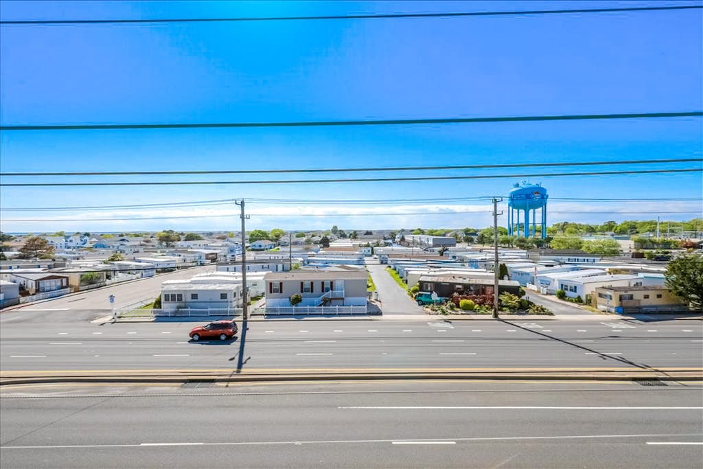 Condo One Block from the Beach w/ Balcony, AC, Laundry & Shared Pool