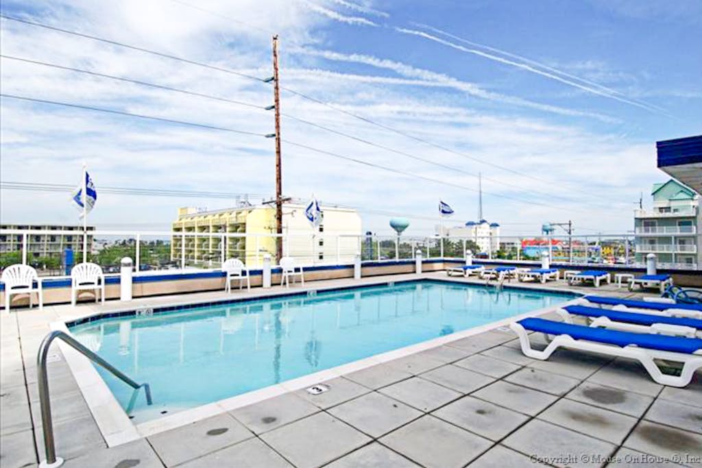 Ocean & Bay View Condo with Balcony, Central AC, WiFi & Community Pool/Gym