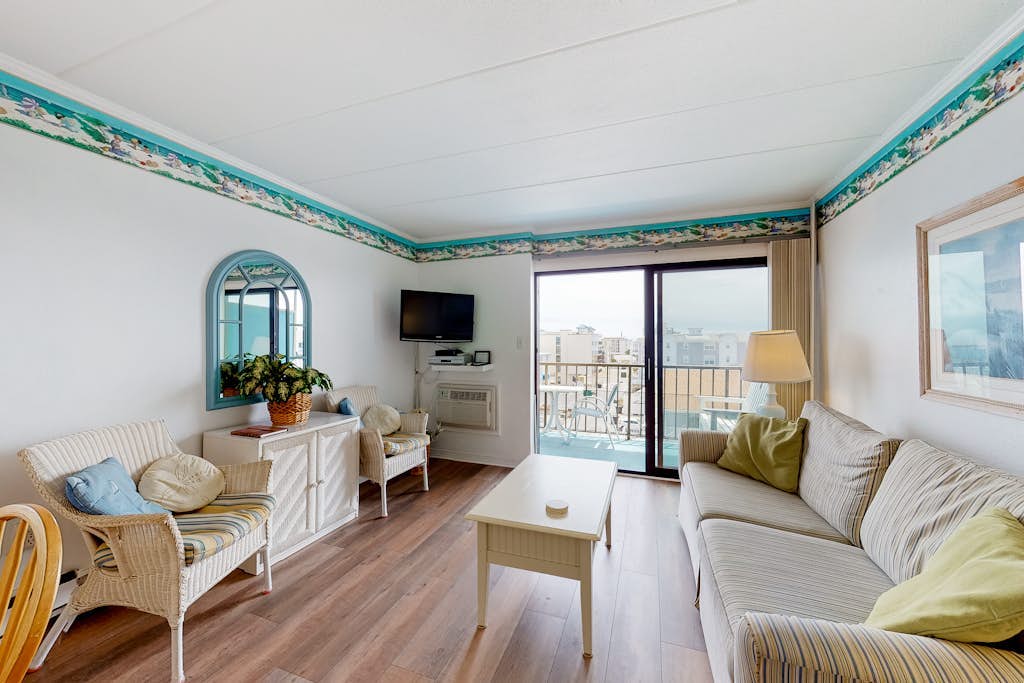 Partial Ocean View Condo w/ Balcony, AC, W/D & Shared Pool - Steps to the Beach