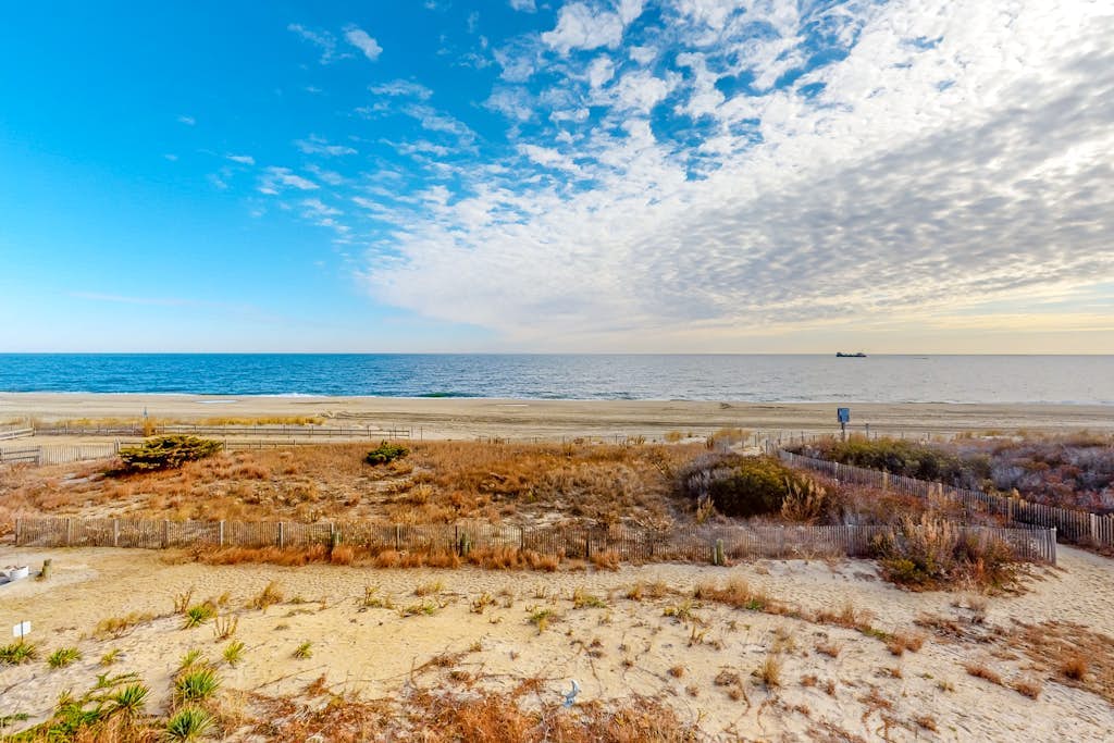 Oceanfront Condo with Direct Beach View, Balcony, AC, WiFi & Laundry