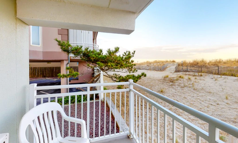 Partial Ocean View Condo in Oceanfront Building with Balcony, WiFi & Laundry