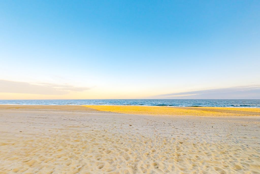 Partial Ocean View Condo in Oceanfront Building with Balcony, WiFi & Laundry