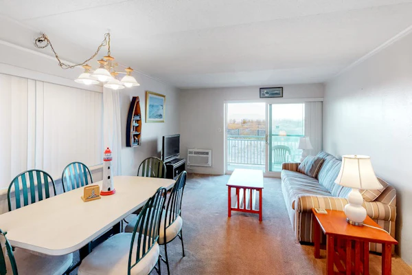 Partial Ocean View Condo in Oceanfront Building with Balcony, WiFi & Laundry
