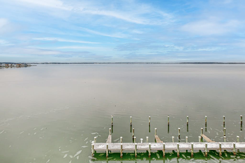 Bayfront Condo with Lovely Sunset Views, Balcony, AC, W/D & Shared Pool