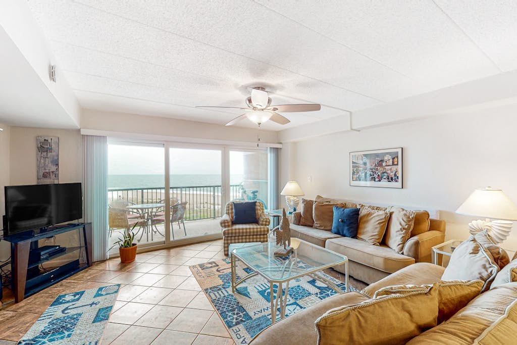 Inviting oceanfront condo with pool, balcony, central AC, & W/D