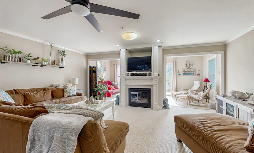 End-unit townhome with resort amenities, water view, balcony, fireplace, & AC