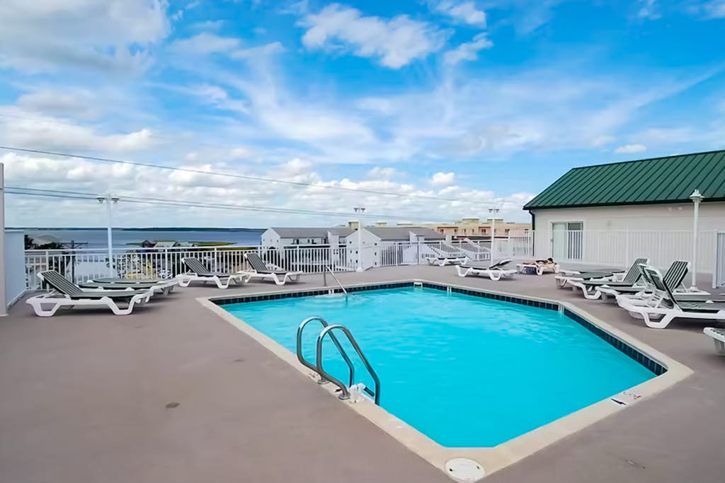 Colorful condo by the beach with balcony, washer/dryer, & outdoor pool