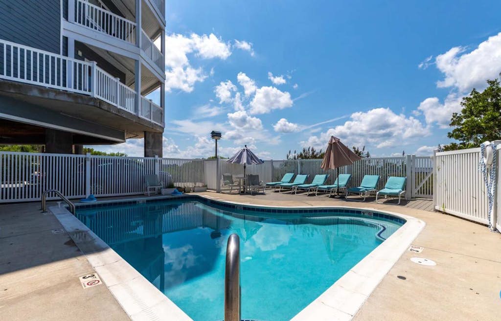 Stunning waterfront condo with bay views, outdoor pool, and private balcony