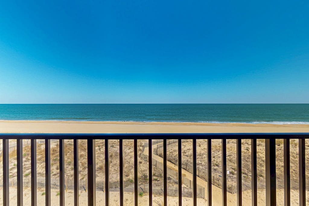 Sunny oceanfront condo with private balcony, ocean views, free WiFi & AC
