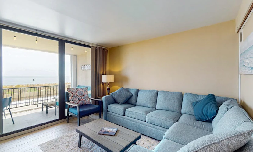 Sunny oceanfront condo with shared pool & deck, W/D, & direct beach access