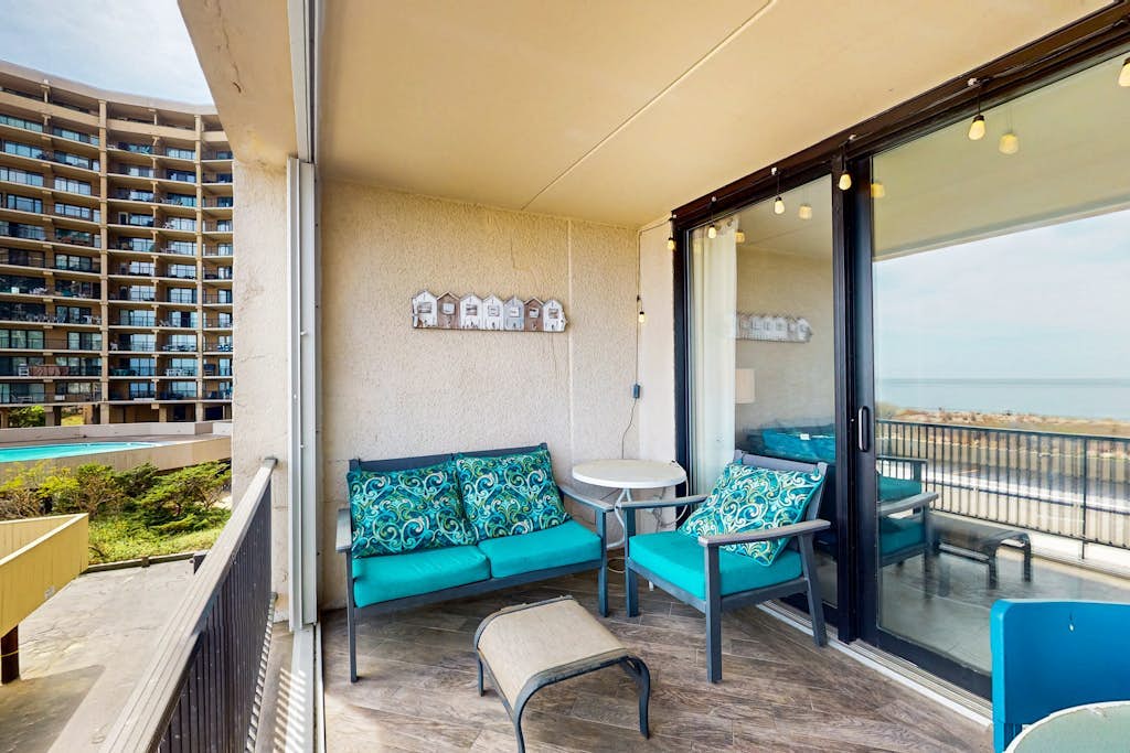 Sunny oceanfront condo with shared pool & deck, W/D, & direct beach access