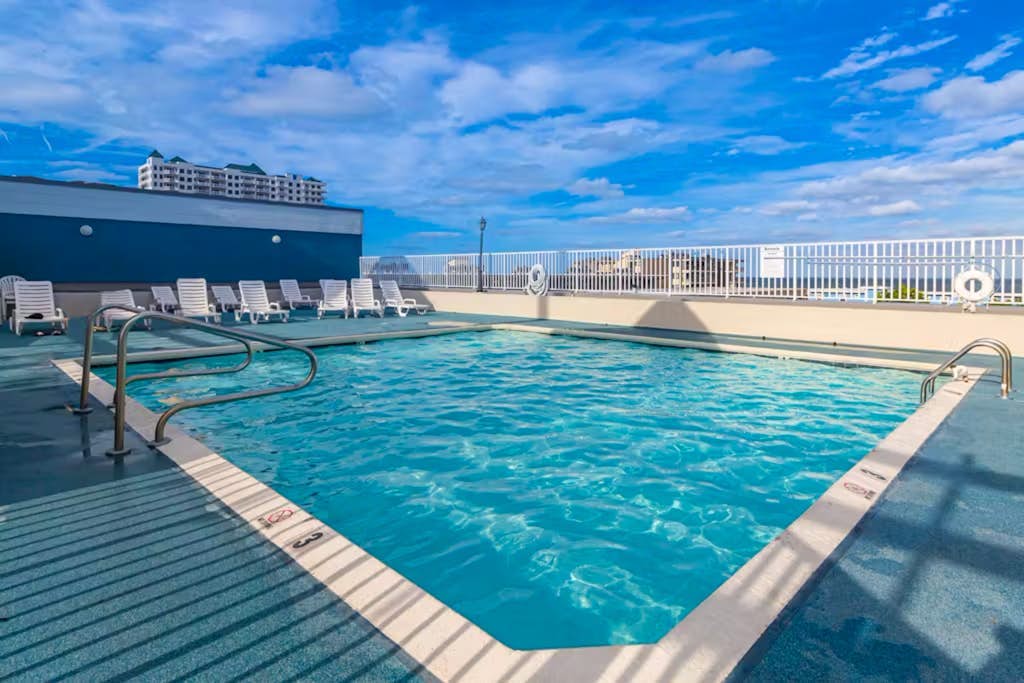 3rd-floor condo with pool, AC, & partial ocean &  bay views from the balcony