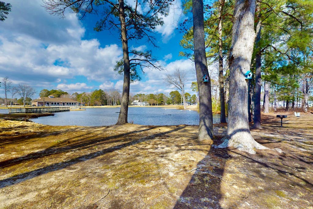 Waterfront townhome on the golf course with private deck, & paid-access pools