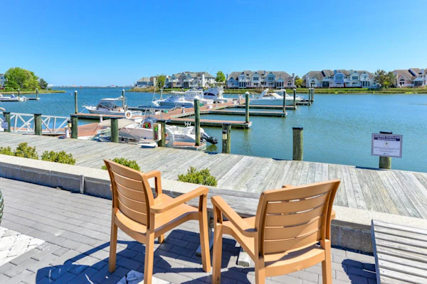 Waterfront townhome on the golf course with private deck, & paid-access pools