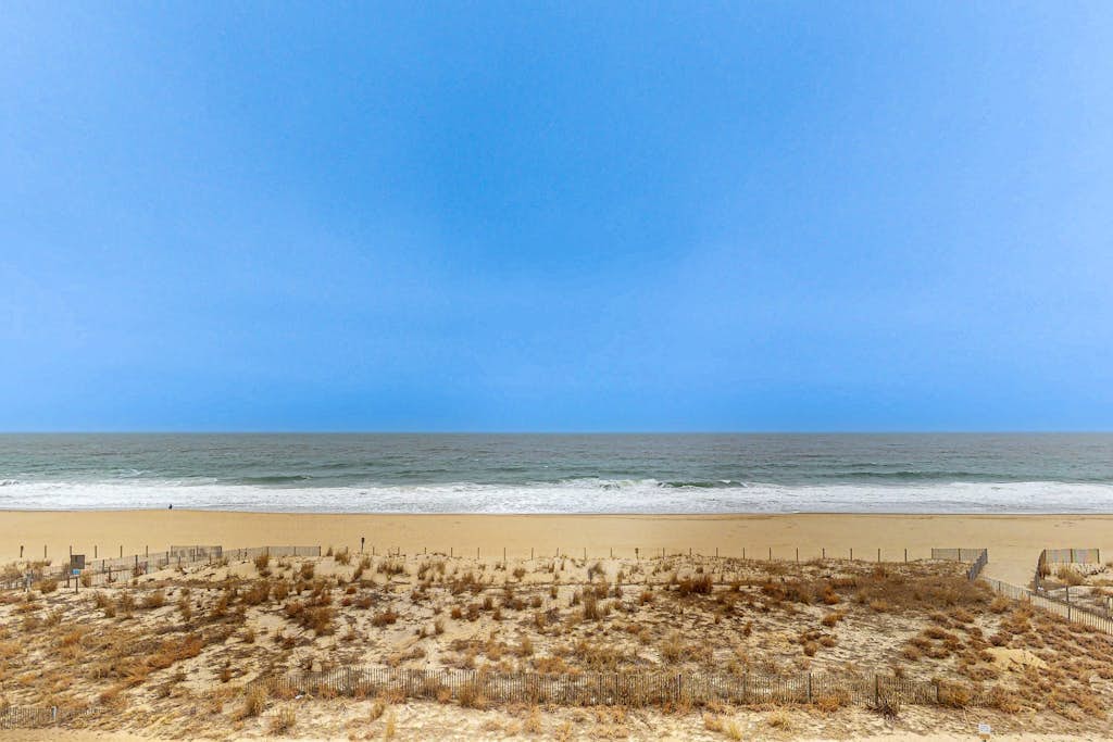 Waterfront condo w/ocean views, beach access, private balcony, W/D, & Central AC
