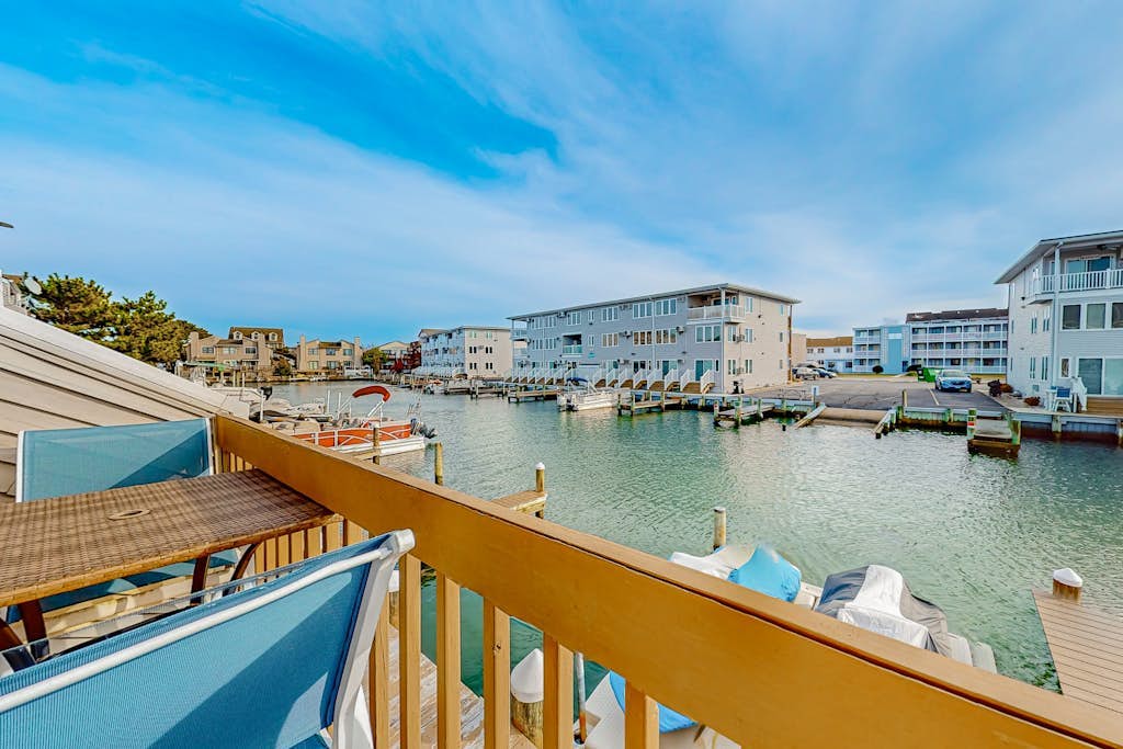 Waterfront condo with scenic balcony, games, fireplace, & W/D - dog-friendly