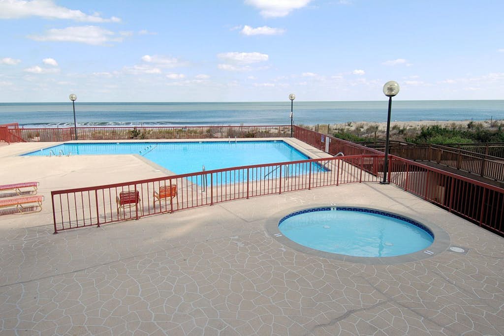 Oceanfront condo near golf & the beach with pool, balcony, W/D, & central AC