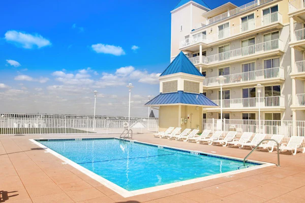 Recently updated oceanfront condo with outdoor pool, sauna, gym, and private W/D