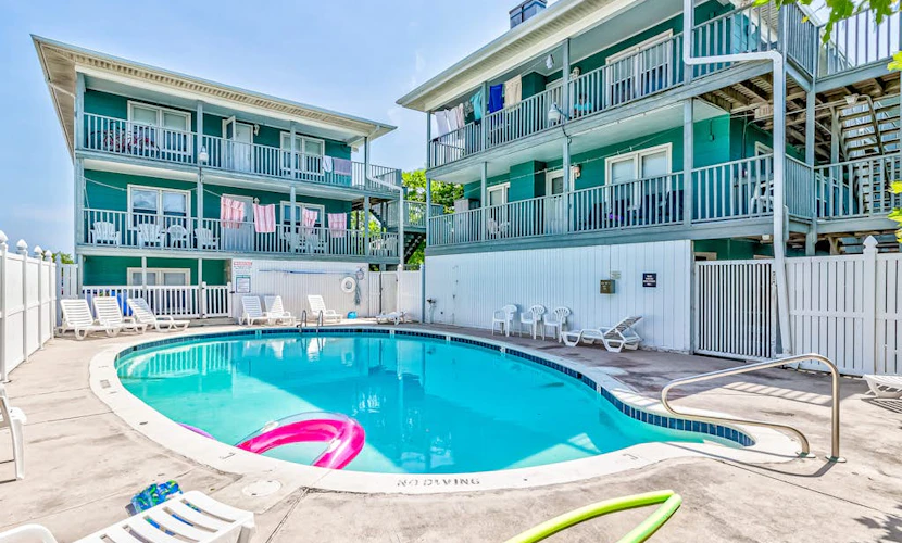 Peek-a-Boo Oceanview Condo with Shared Pool & Prime Location 1 Block from Beach