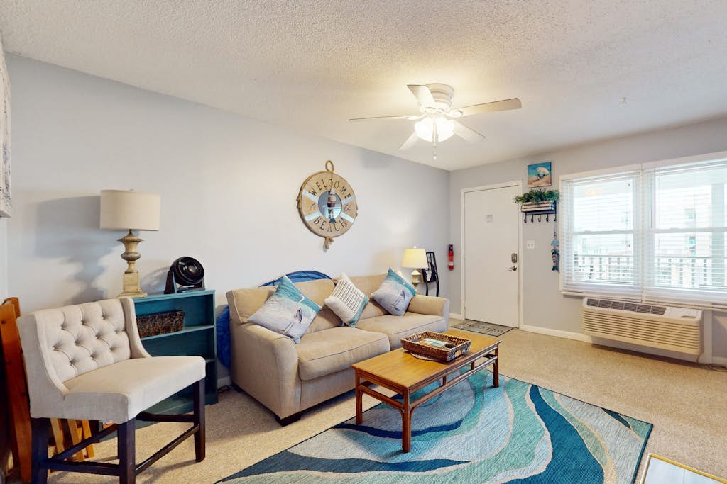 Peek-a-Boo Oceanview Condo with Shared Pool & Prime Location 1 Block from Beach
