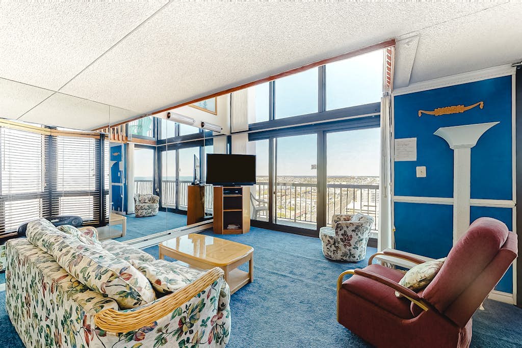 Stylish beach condo with prime beach views, balcony, pools, gym & sauna