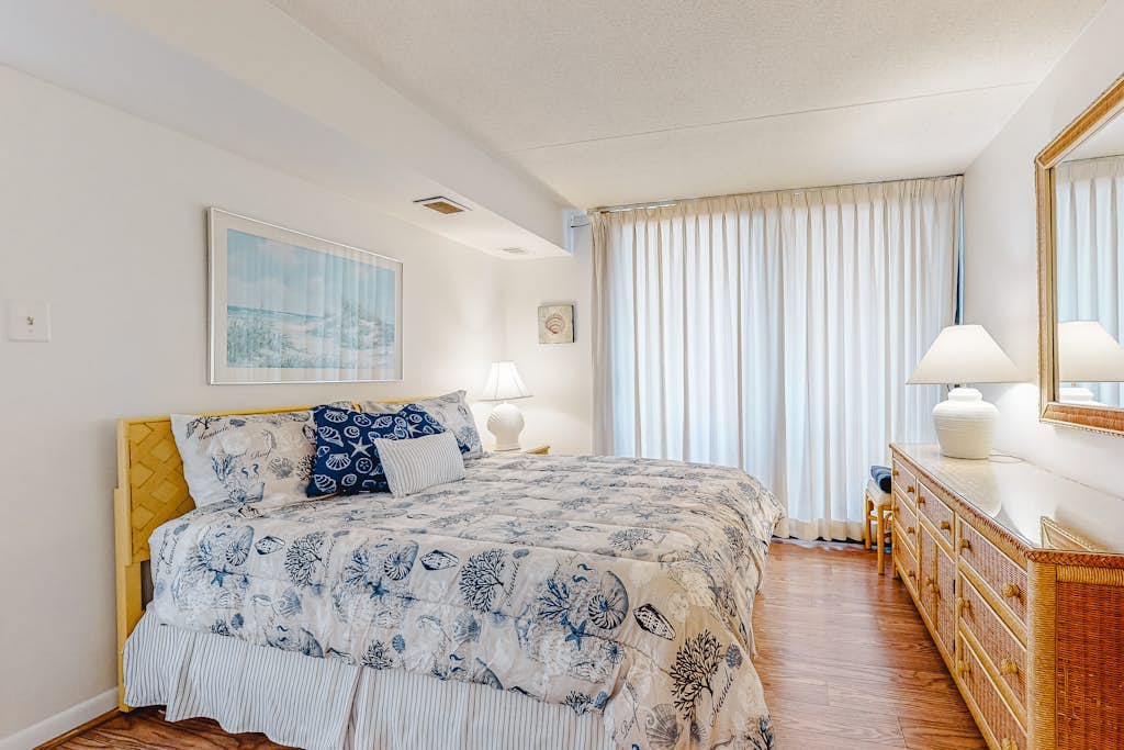 Welcoming beach retreat with tennis court views, pools, gym & sauna