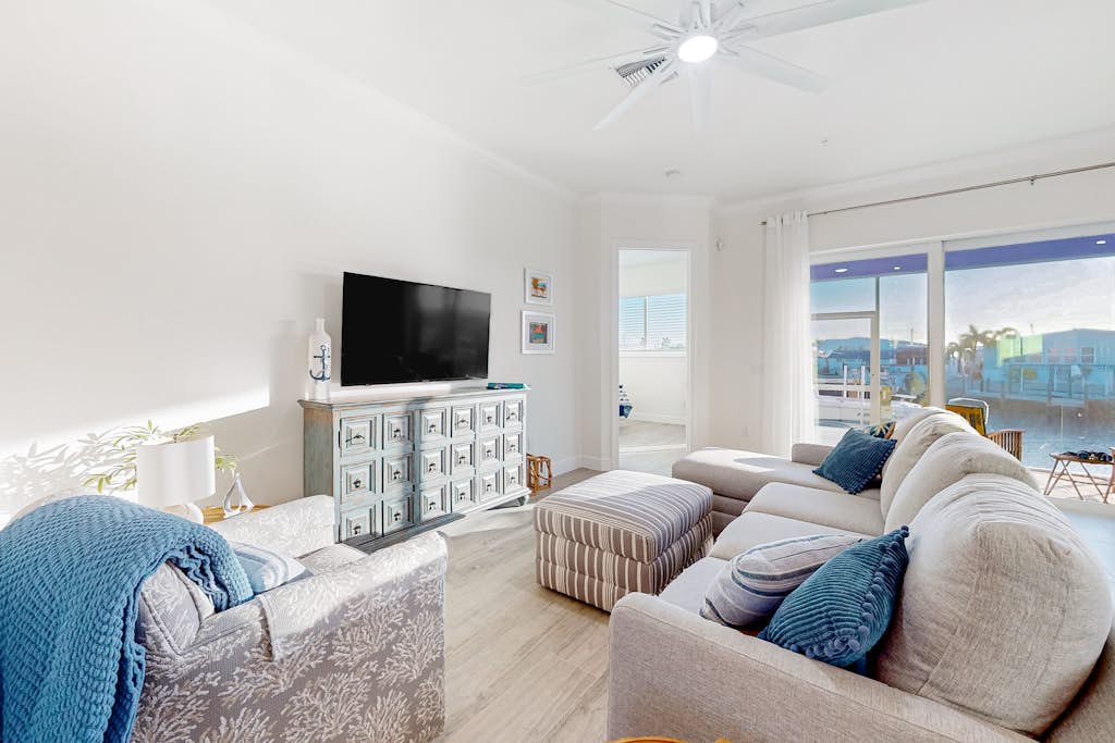 Dog-friendly, canal-front getaway with a dock, screened lanai, & washer/dryer