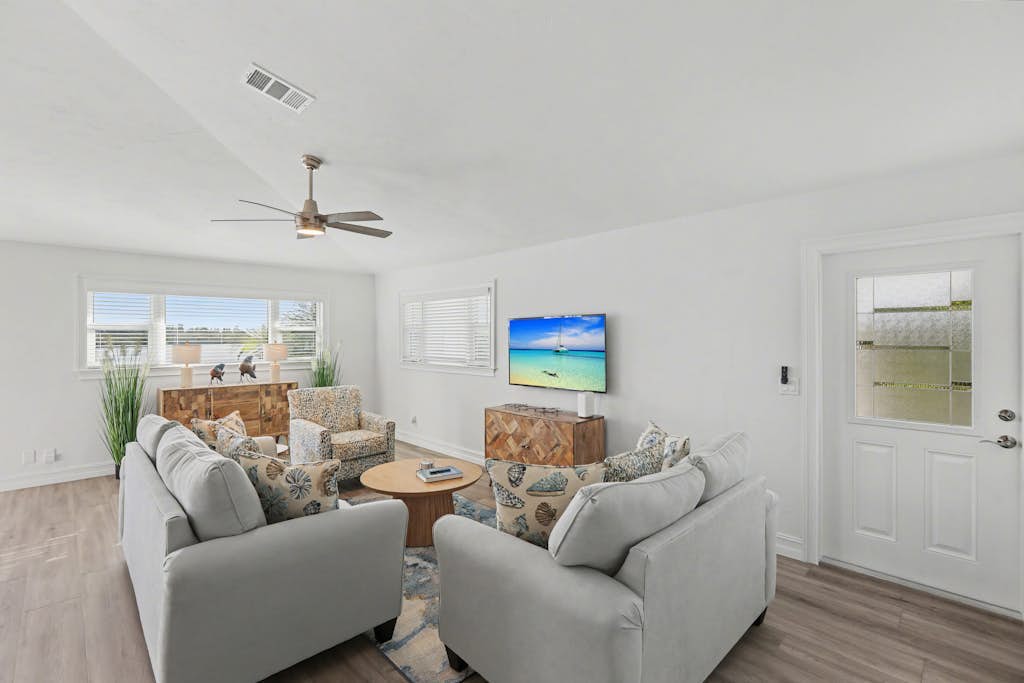 Immaculate bay front home w/in ground pool, spa, paver patio & porch