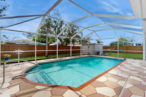Spacious home with enclosed pool and patio and near attractions