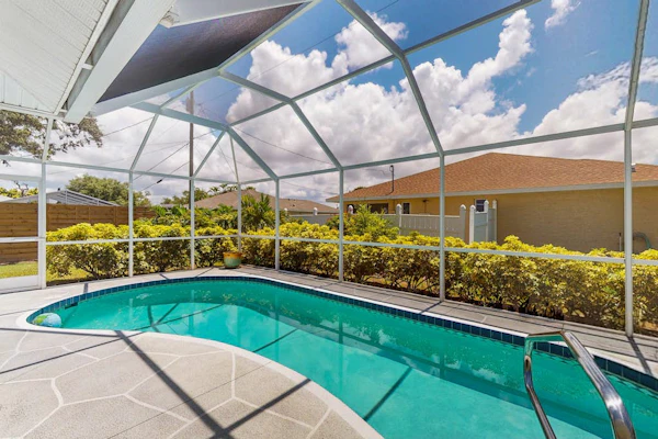 Spacious home with private saltwater heated pool, gas grill, close to the beach