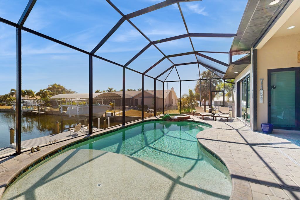 Ultimate waterside retreat with private dock, lanai, pool & spa, BBQ and WiFi