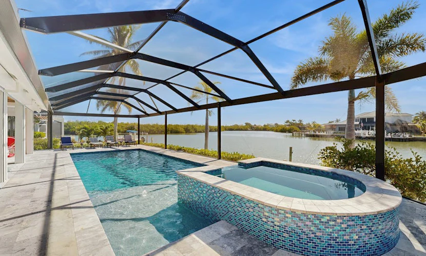 Spacious canal front home with private pool, dock & close to everything