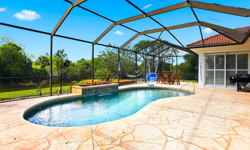 Waterfront home with private heated pool, dock, firepit, grill, bikes, fireplace