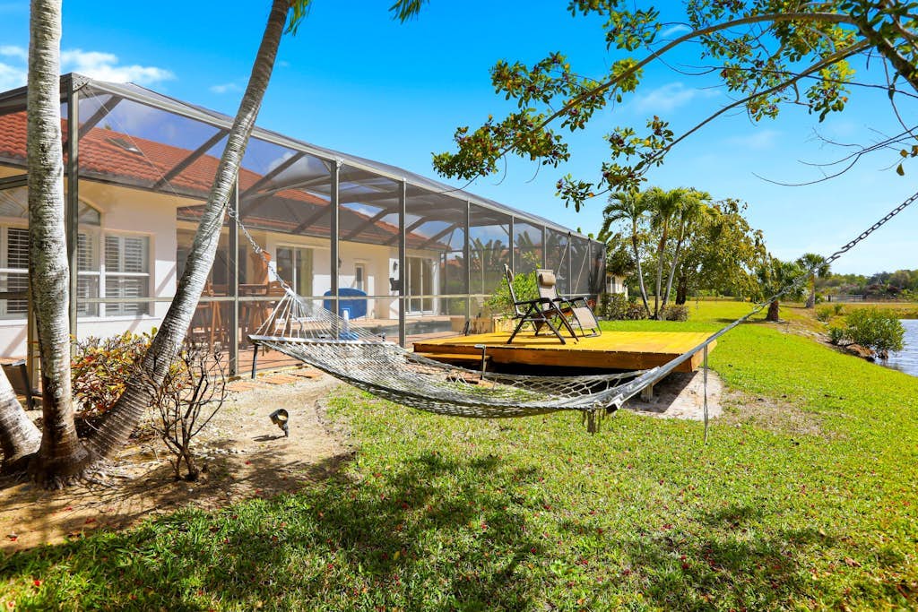 Waterfront home with private heated pool, dock, firepit, grill, bikes, fireplace