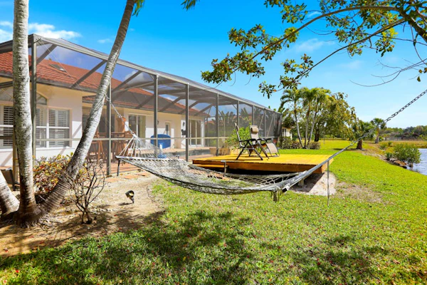 Waterfront home with private heated pool, dock, firepit, grill, bikes, fireplace