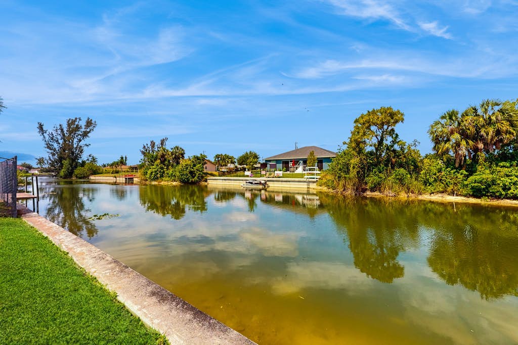 Spacious dog-friendly home with private pool, canal views & private grill