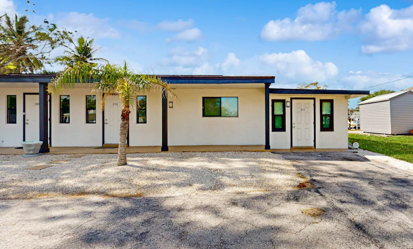 Canal front apartment with waterfront views, private patio, and yard