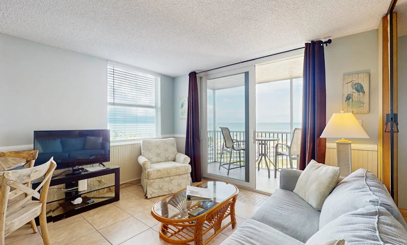 Coastal beach studio with panoramic views, pool, and direct beach access