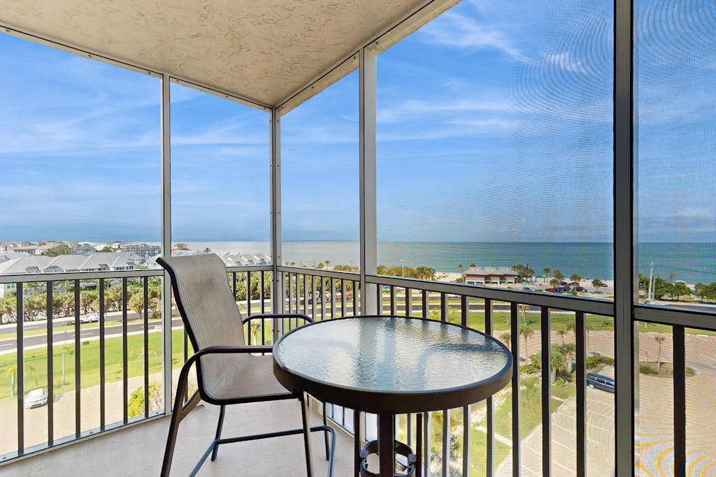 Coastal beach studio with panoramic views, pool, and direct beach access