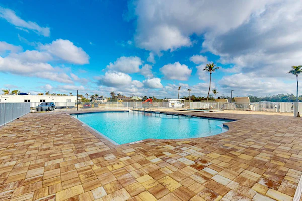Coastal beach studio with panoramic views, pool, and direct beach access