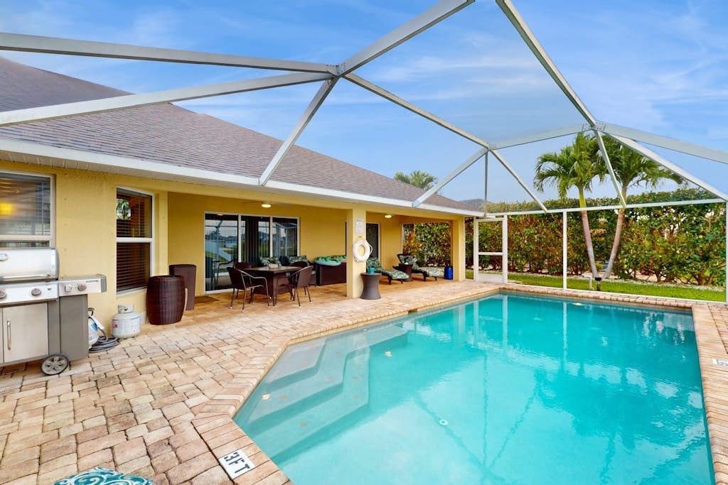 Luxe Tropical Retreat with Screened Lanai, Private Pool, Dock & Billiards