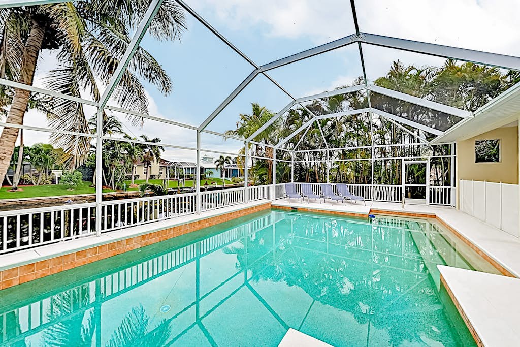 Dog-friendly canal-front home with a private pool & dock in a prime location
