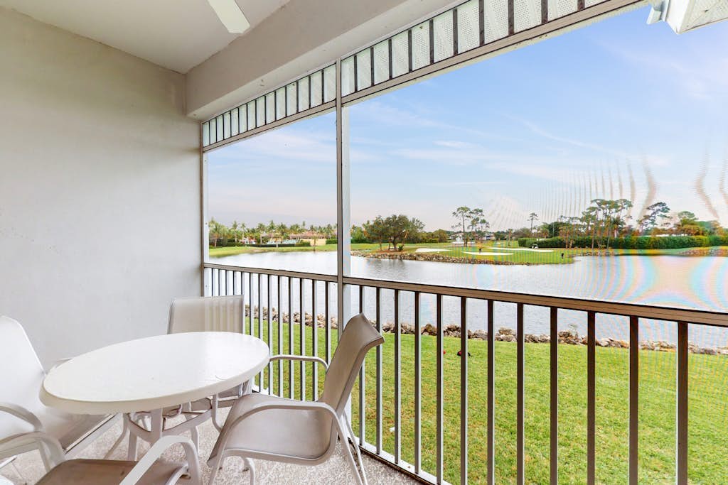 Spacious 2nd-floor condo with lake/golf view - walk to restaurant, tennis & pool