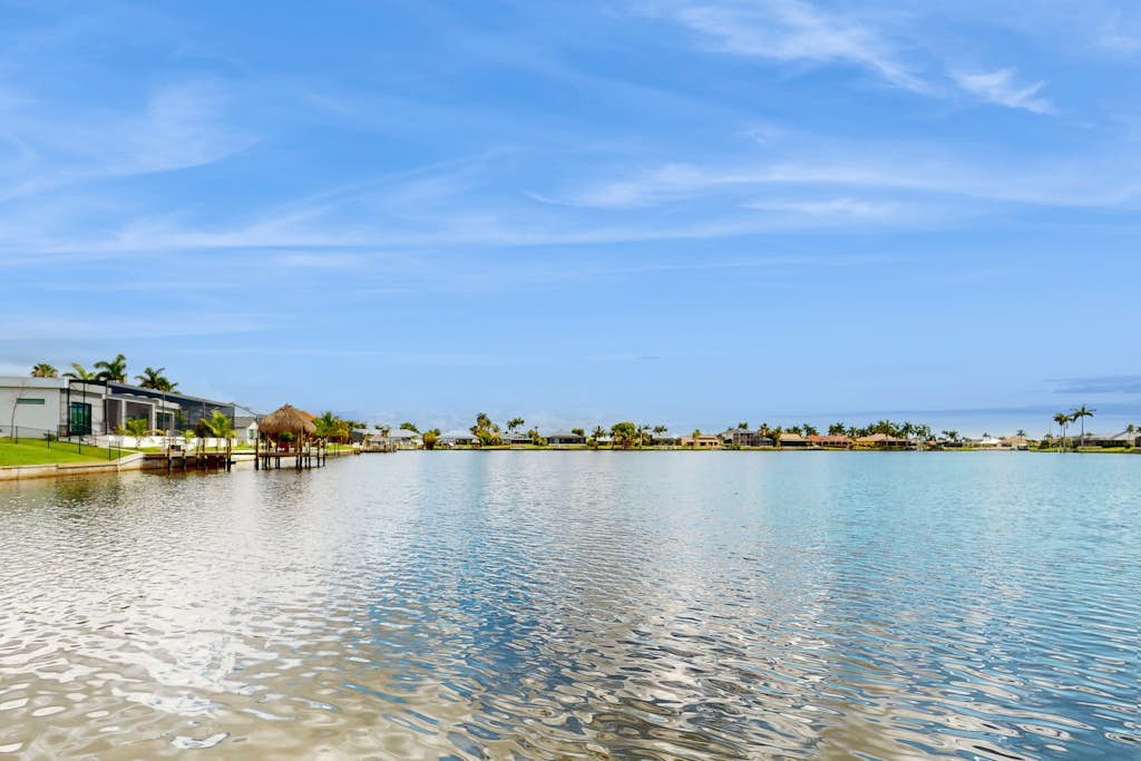 Villa Aasta | Luxe Lakefront Outdoor Living | Screened Pool, Game Room & Dock