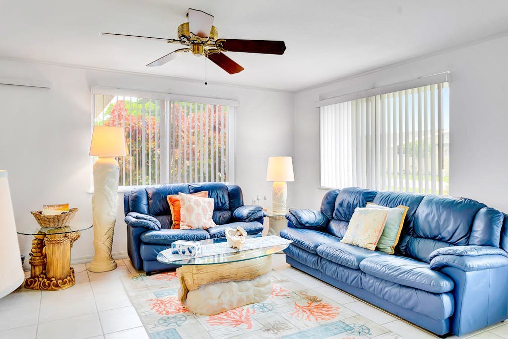 Waterfront home with canal access, patio, sun room, & central AC - near beach