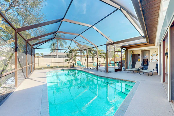 Dog-friendly home with a private heated pool, screened lanai, W/D, & AC