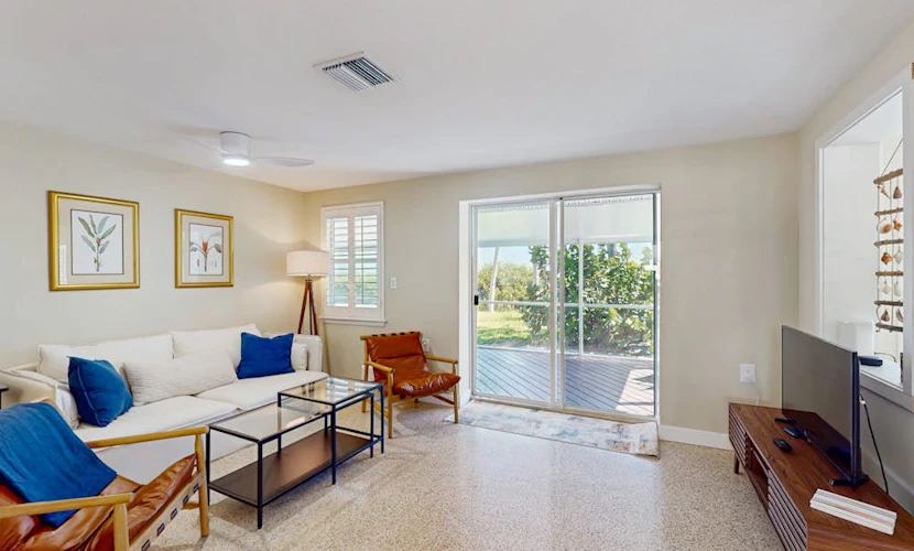 Bayfront oasis with screened lanai, views, private dock, & beach access nearby